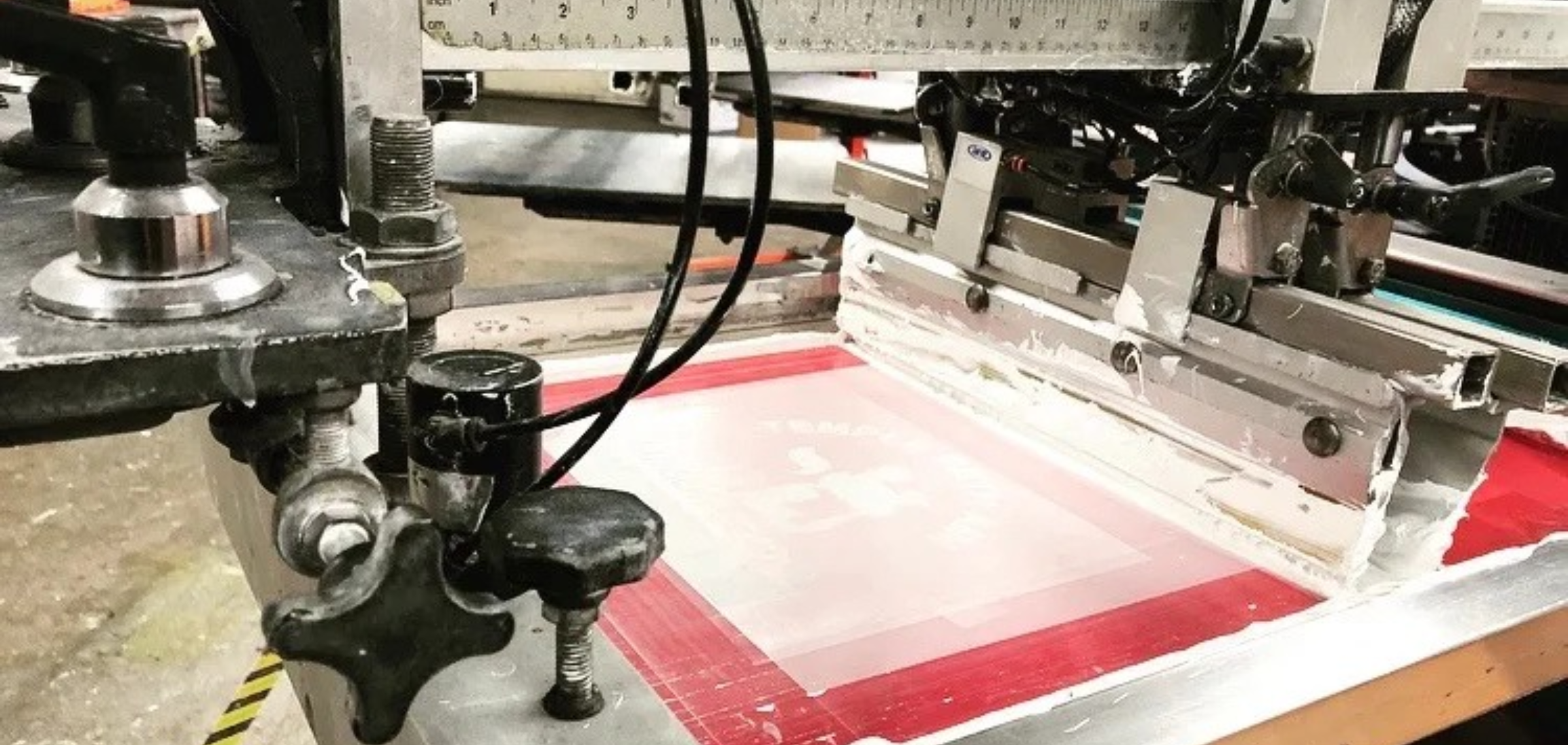 Classic screen printing press in production